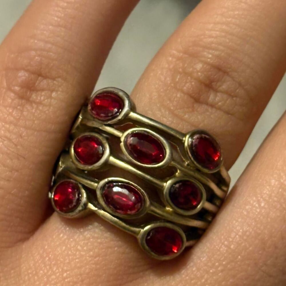 Chunky gold ring with red oval gemstones